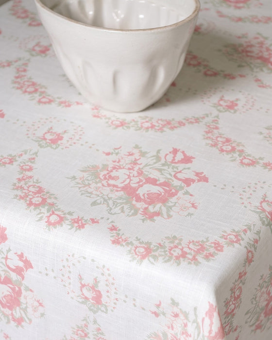 White ceramic bowl on a floral-patterned tablecloth