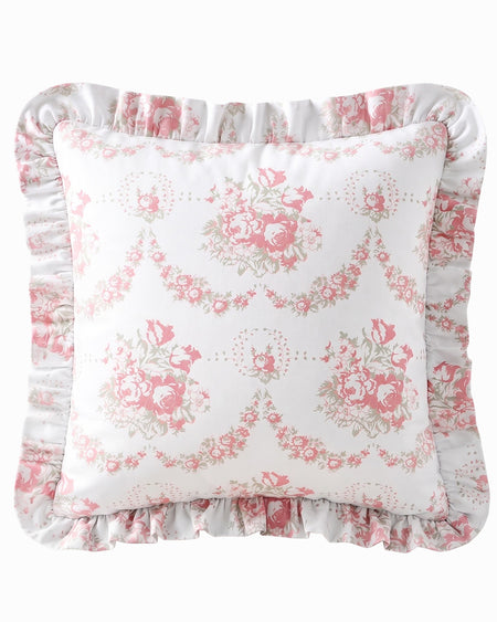 Floral patterned pillow with ruffled edges on a white background