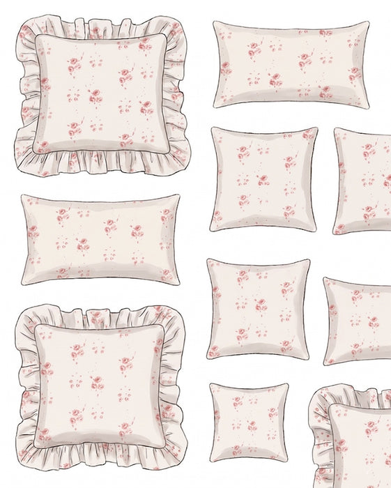 Set of decorative pillows with floral patterns and ruffled edges on a white background