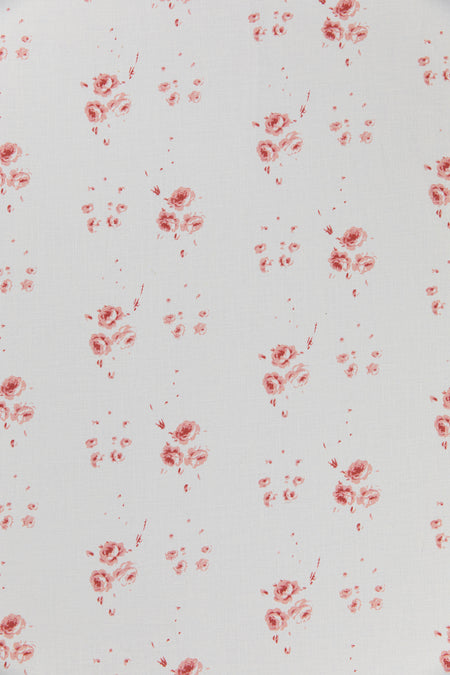 Red floral pattern on a light gray background