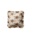 Floral patterned pillow with ruffled edges on a white background