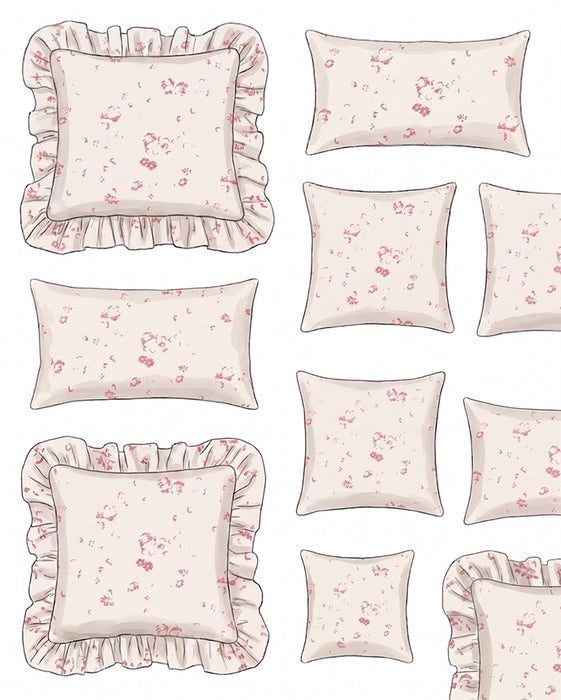 Set of decorative pillows with floral patterns and ruffled edges on a light background