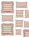 Collection of red and white striped pillows with ruffled edges on a white background