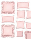 Collection of pink pillows with ruffled edges on a white background