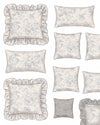 Set of floral-patterned cushions with ruffled edges on a white background