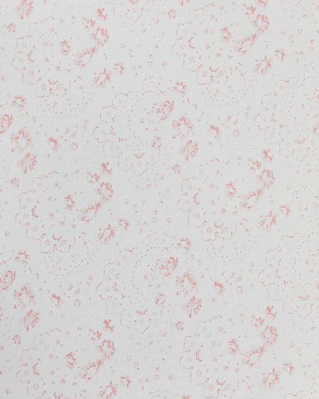 Close-up of white linen fabric with a subtle pink floral print.
