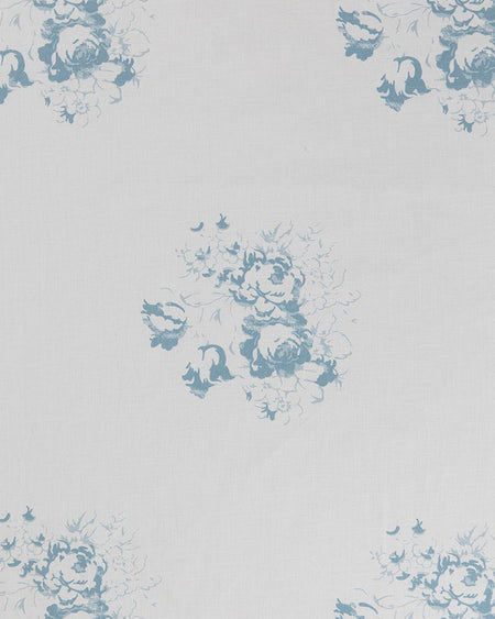 A patterned fabric with blue floral motifs on a white background.