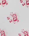 White linen fabric with a red floral bouquet motif printed across it.