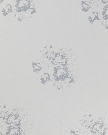 A sheet of white linen with a faded floral motif in a subtle blue tone.