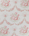 A fabric with a floral pattern featuring red and green flowers on a white background.