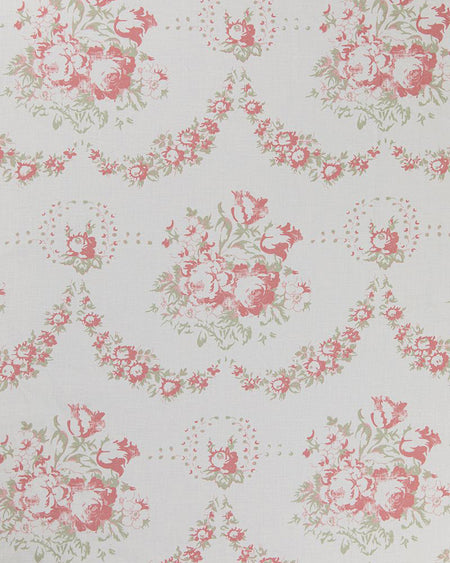 A fabric with a floral pattern featuring red and green flowers on a white background.
