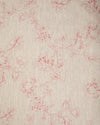 A close-up image of natural linen fabric with a red floral pattern.