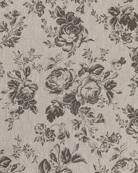 A fabric with a floral pattern featuring roses in charcoal gray on a natural linen background.