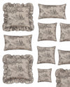 Collection of decorative pillows with toile pattern on a white background