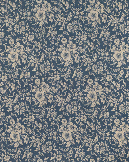 Floral patterned fabric with beige flowers on a blue background