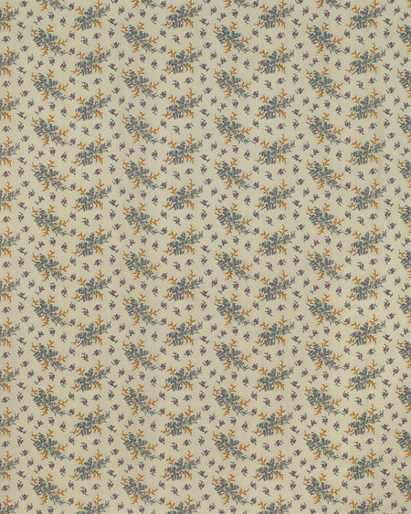 Floral patterned fabric with small blue and yellow flowers on a beige background